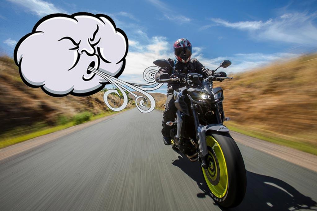 Wind blowing a motorcyclist
